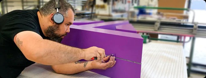 About Us Sign Fabrication Team